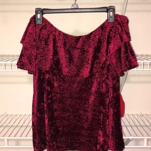 A red velvet off the shoulder shirt!